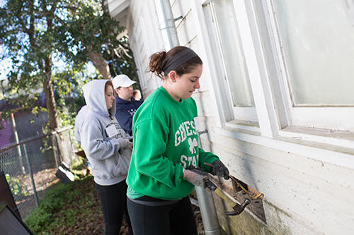 Students on a hurricane relief trip with Livingston CARES.