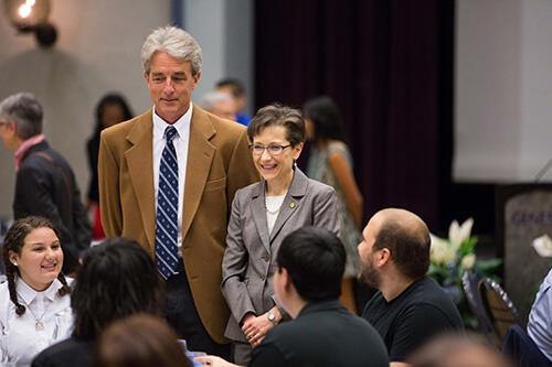 Photo of President Denise A. Battles and Dr. Michael Mills with students