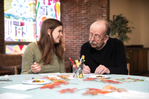 Raina Schoen Thomas ’20 and the late Terry Price ’58 at the Home Away From Home program. 