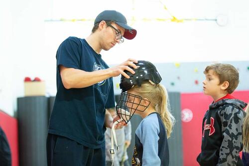 Stephen Mott '18 with dek hockey team members