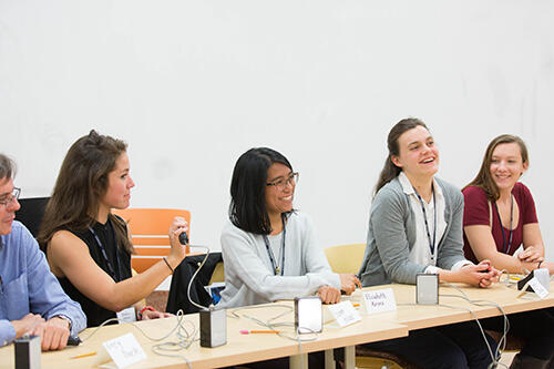 Panelists speak at the conference.