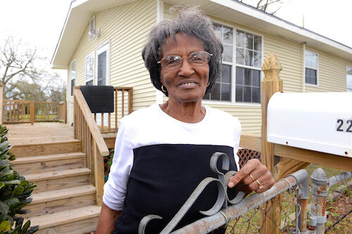 Gladys Daniels outside her home.