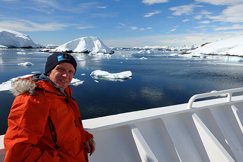 Geneseo teacher Randy French '83 in Antarctica on a boat.