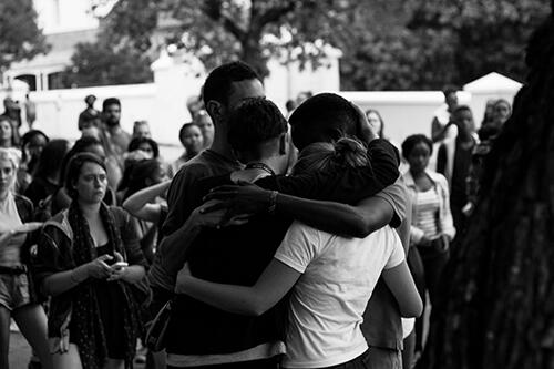 Photo by Sam Aviles '17, of students reuniting after being arrested during a protest.
