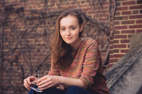 Sarah Simon '17 on a step outside of Sturges Hall.