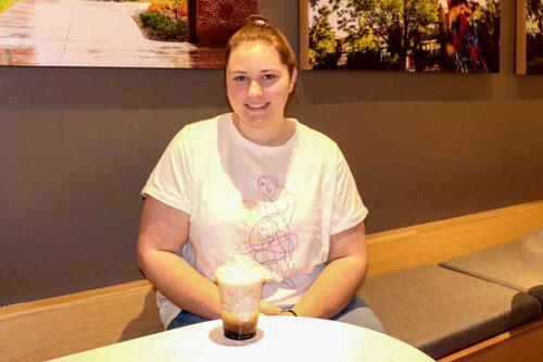 Starbucks barista Maggie Hewitt '22 with a Geneseo Sunrise