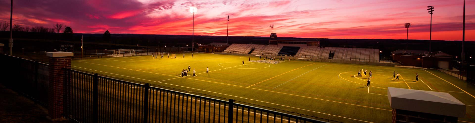 Athletic stadium at sunset.