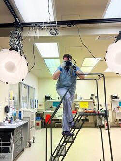 Hunter Kane '16 photographing in lab