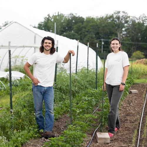 Sean Perry and Bari Zeiger standing in a field