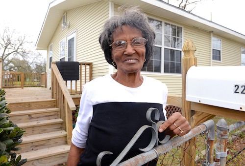 Homeowner Gladys Daniels outside of her rebuilt home in Biloxi.