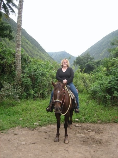 Colleen Garrity riding a horse.