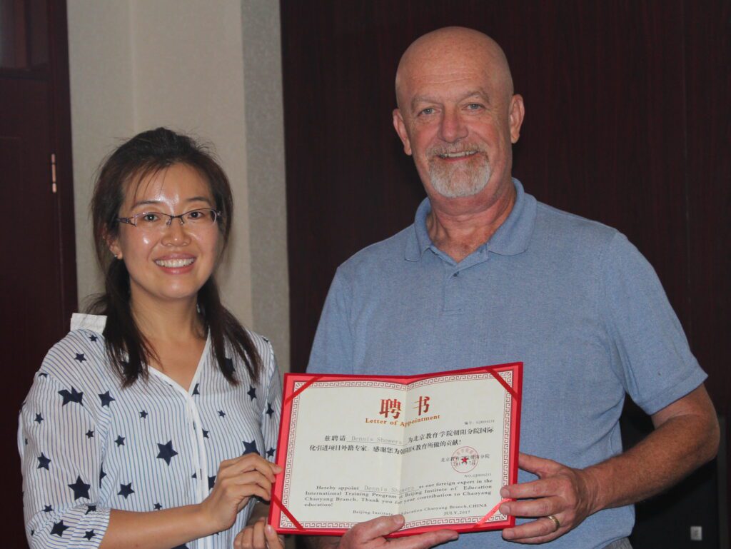 Dr. Showers receiving a certificate acknowledging him as a Foreign Expert in Interdisciplinary Teaching by The Changyang District of Beijing Schools