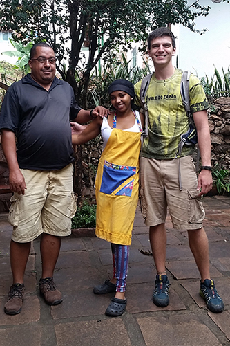Justen Geddes '18 and a local family.