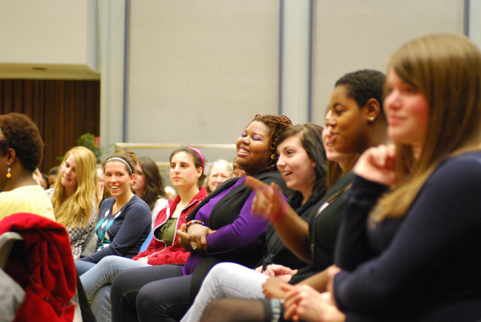 Speaker talking with arms outstretched