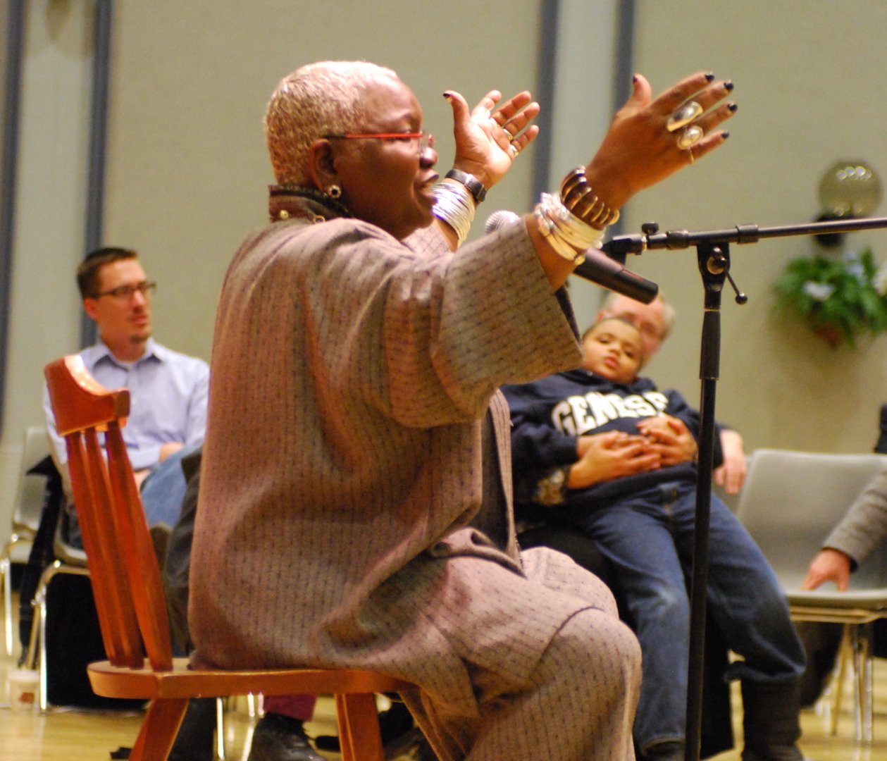 Students laugh and applaud speaker
