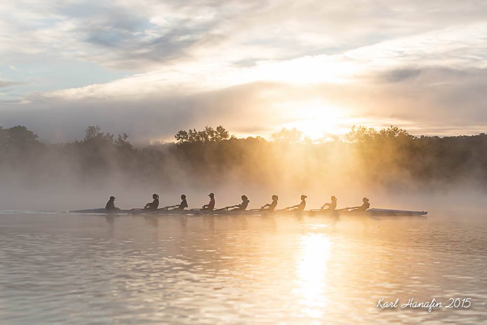 Crew member holding up a poster