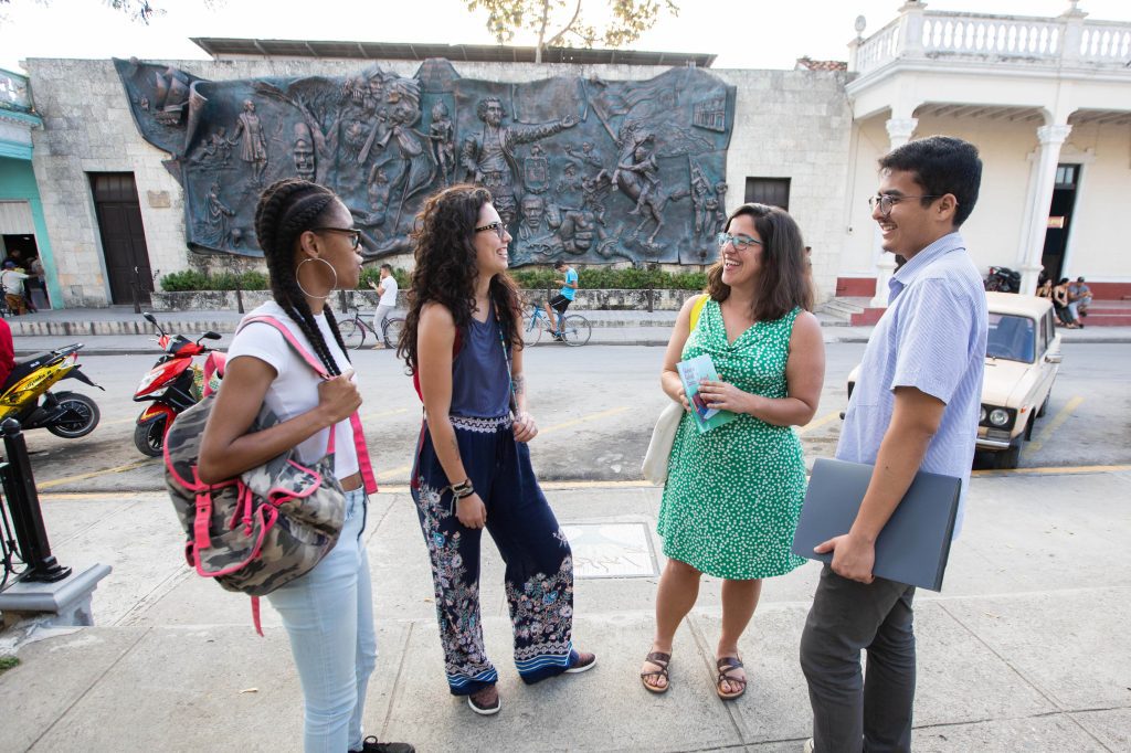 Sam Cardamone, associate director of the Study Abroad Office, at right, and Melanie Medeiros, assistant professor of anthropology, second to right, with representatives in Cuba.