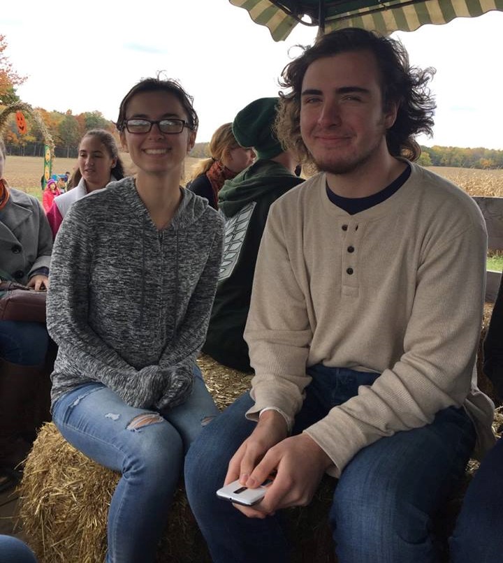 PRISM Math Club: Student on a truck posing for a photo