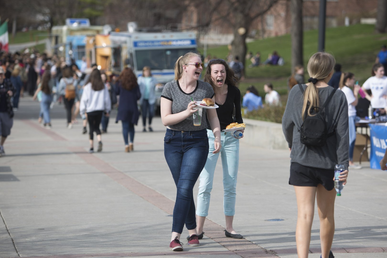 Happy Genny Fest 2018 attendees carrying food.
