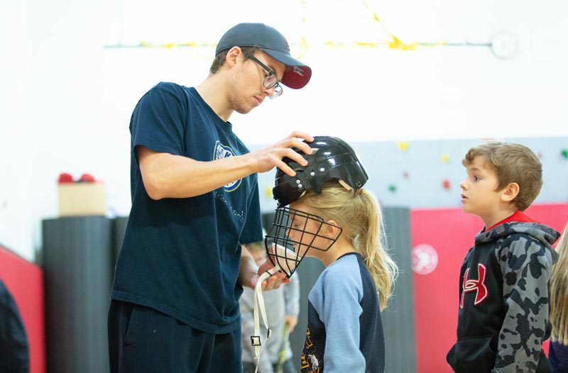Stephen Mott '18 with dek hockey team members