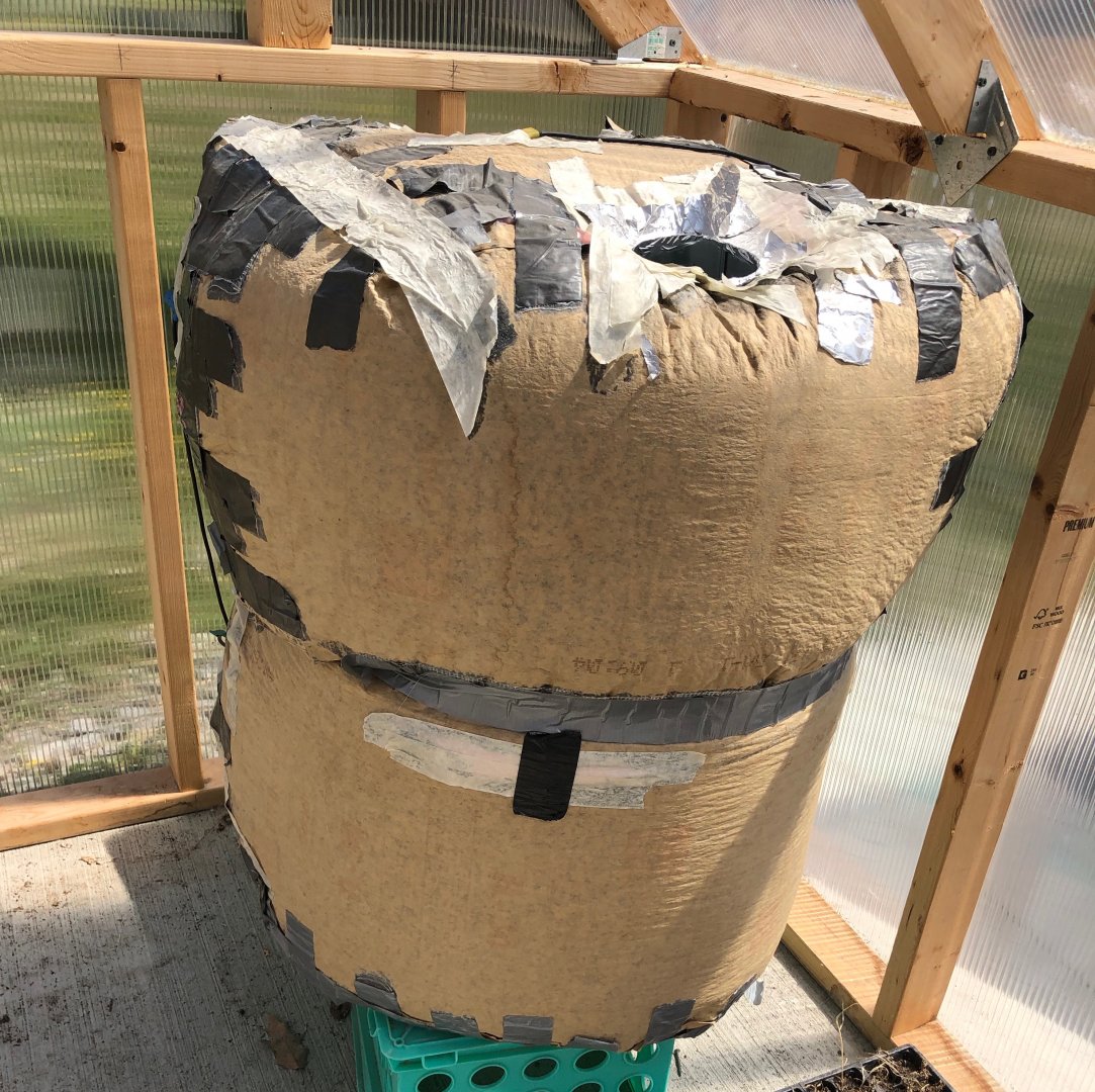 The heat capacitor, aka a metal garbage can full of crushed cans and wrapped in home insulation