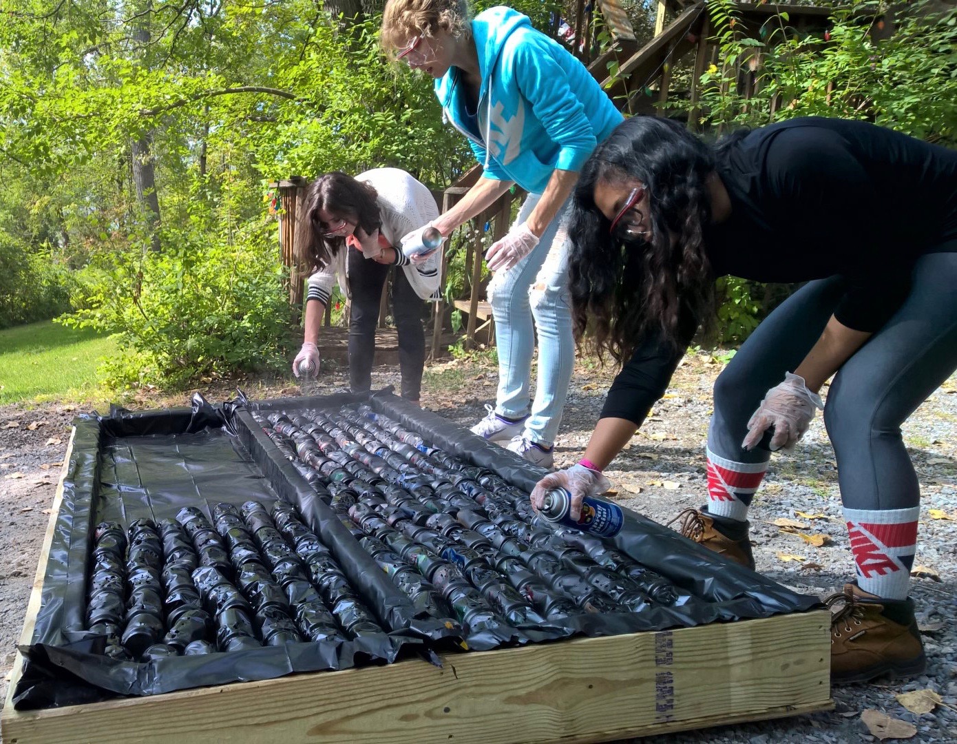 Painting the cans in the collector black.