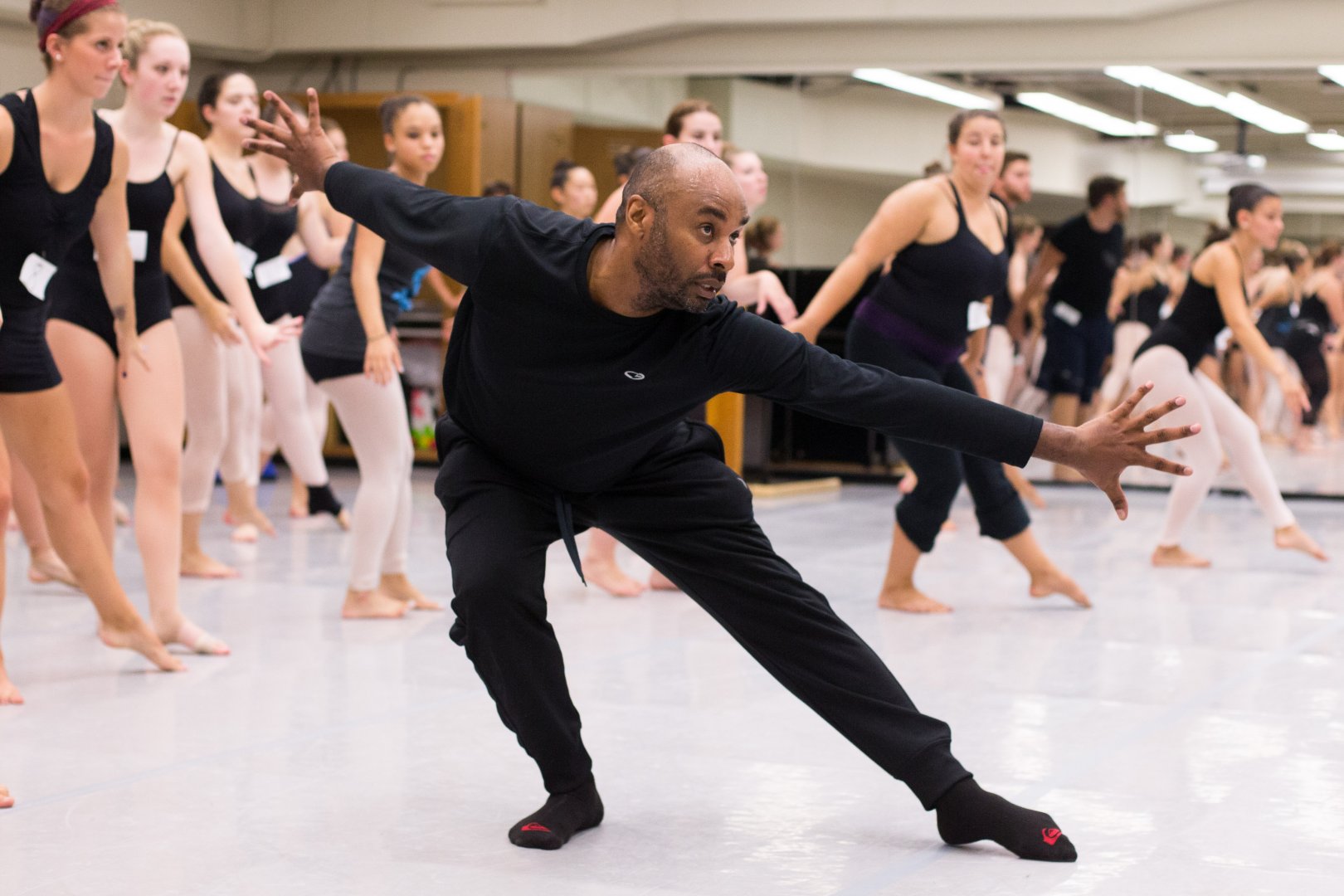 Dance instructor with class