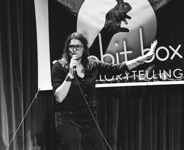 ssor of communication Lee Pierce performing stand-up