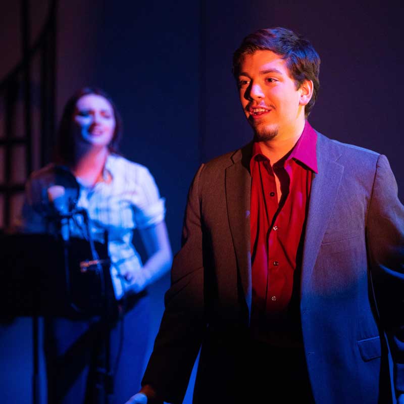 man singing in musical