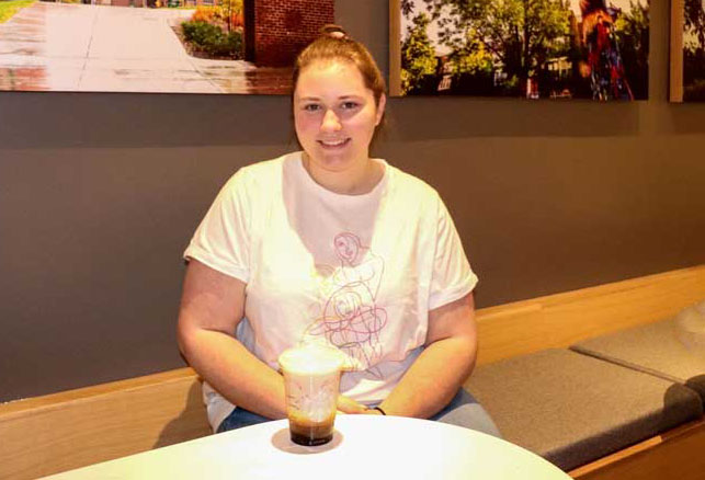 Starbucks barista Maggie Hewitt '22 with a Geneseo Sunrise