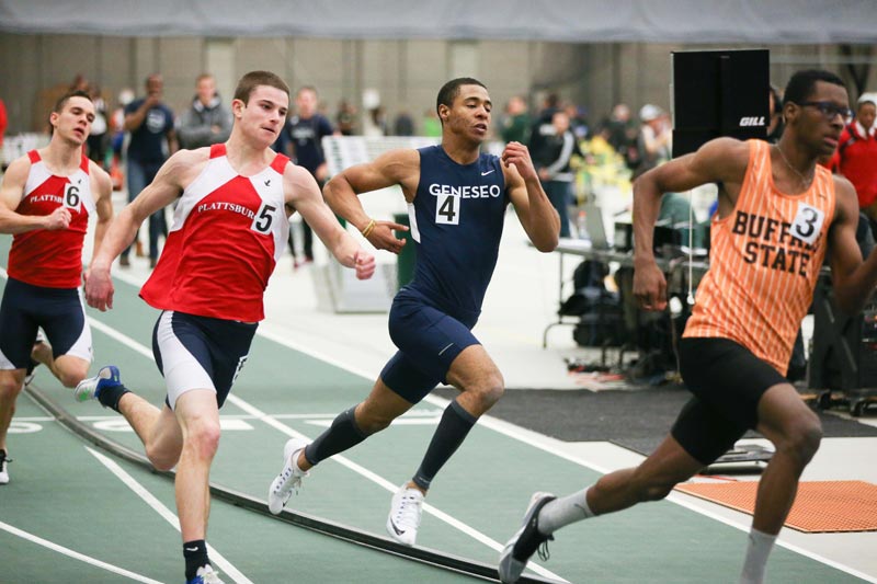 A SUNY Geneseo runner strains to pulls ahead from behind during a competition. A SUNY Geneseo runner strains to pulls ahead from behind during a competition.