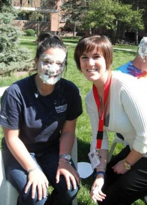 pied professor and organizer posing