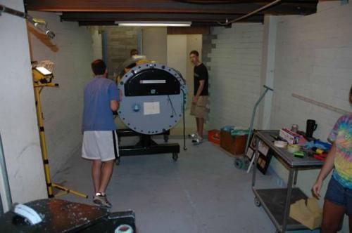 Students working on machine in lab