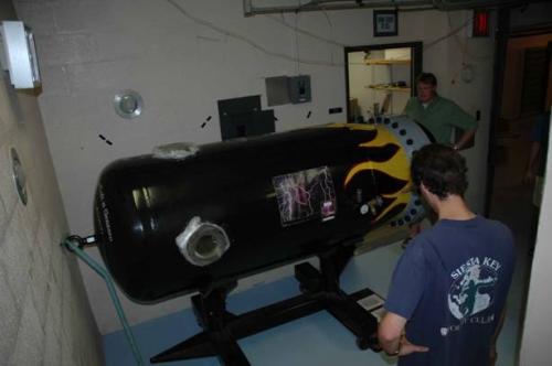 Students working on machine in lab
