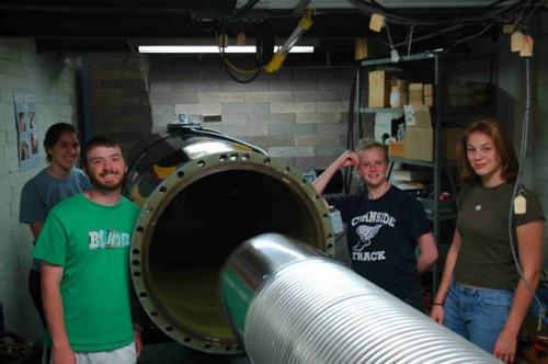 Students working on machine in lab 