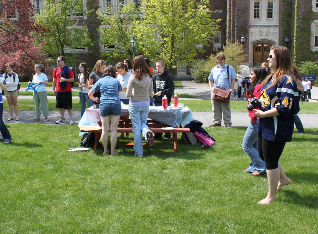 Pi in the face for autism event: students with pies