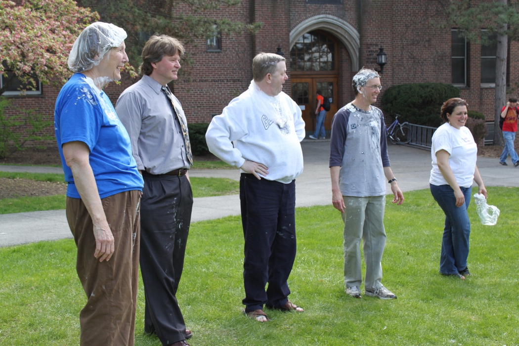 Pi in the face for autism event: gathered around table