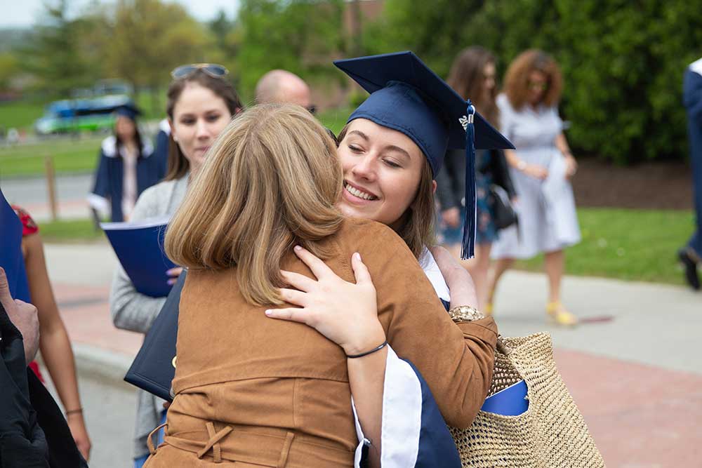 relative hugging graduate