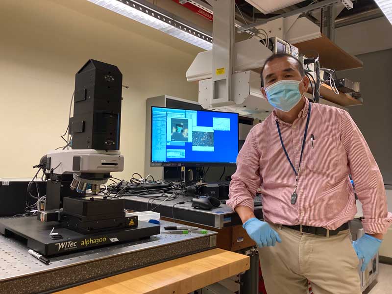 Chemistry professor Kazushige Yokoyama with Raman imaging system