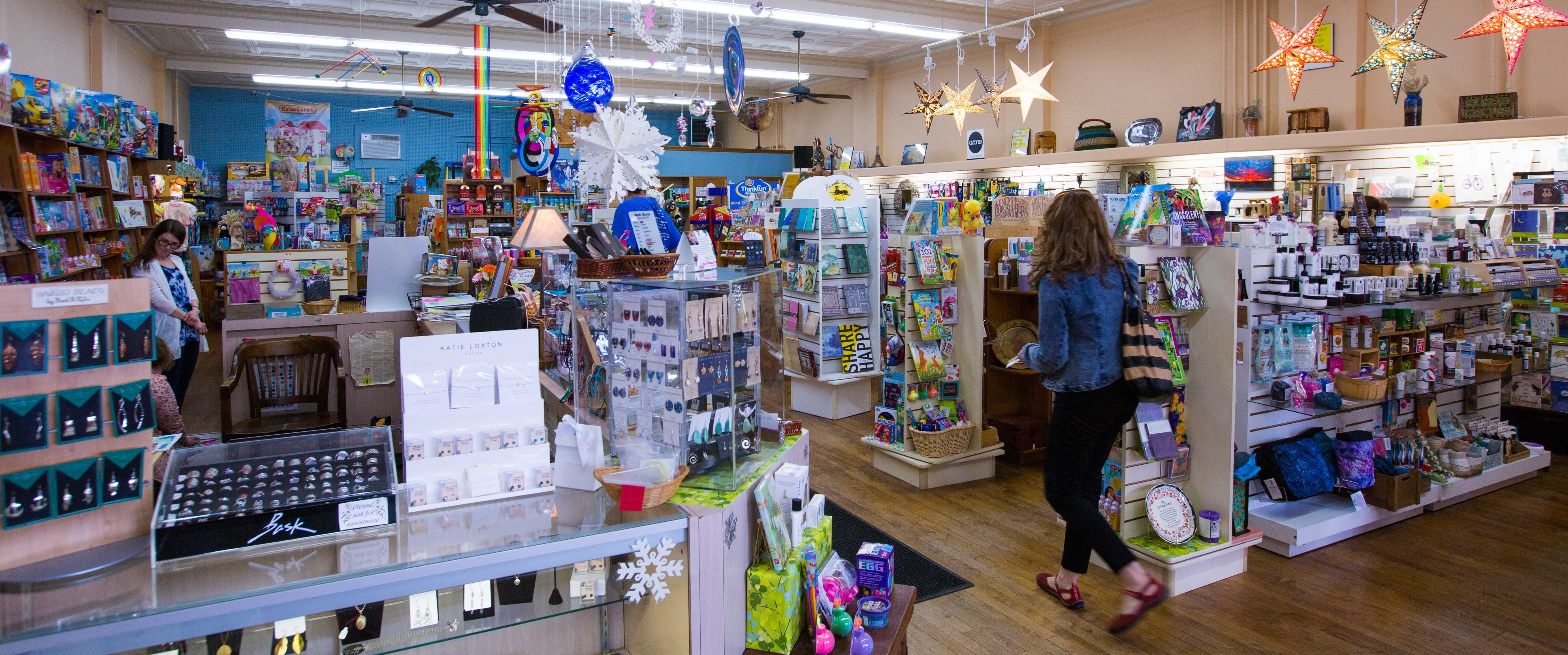MainStreetShopping Person walking through SUNY Geneseo gift shop