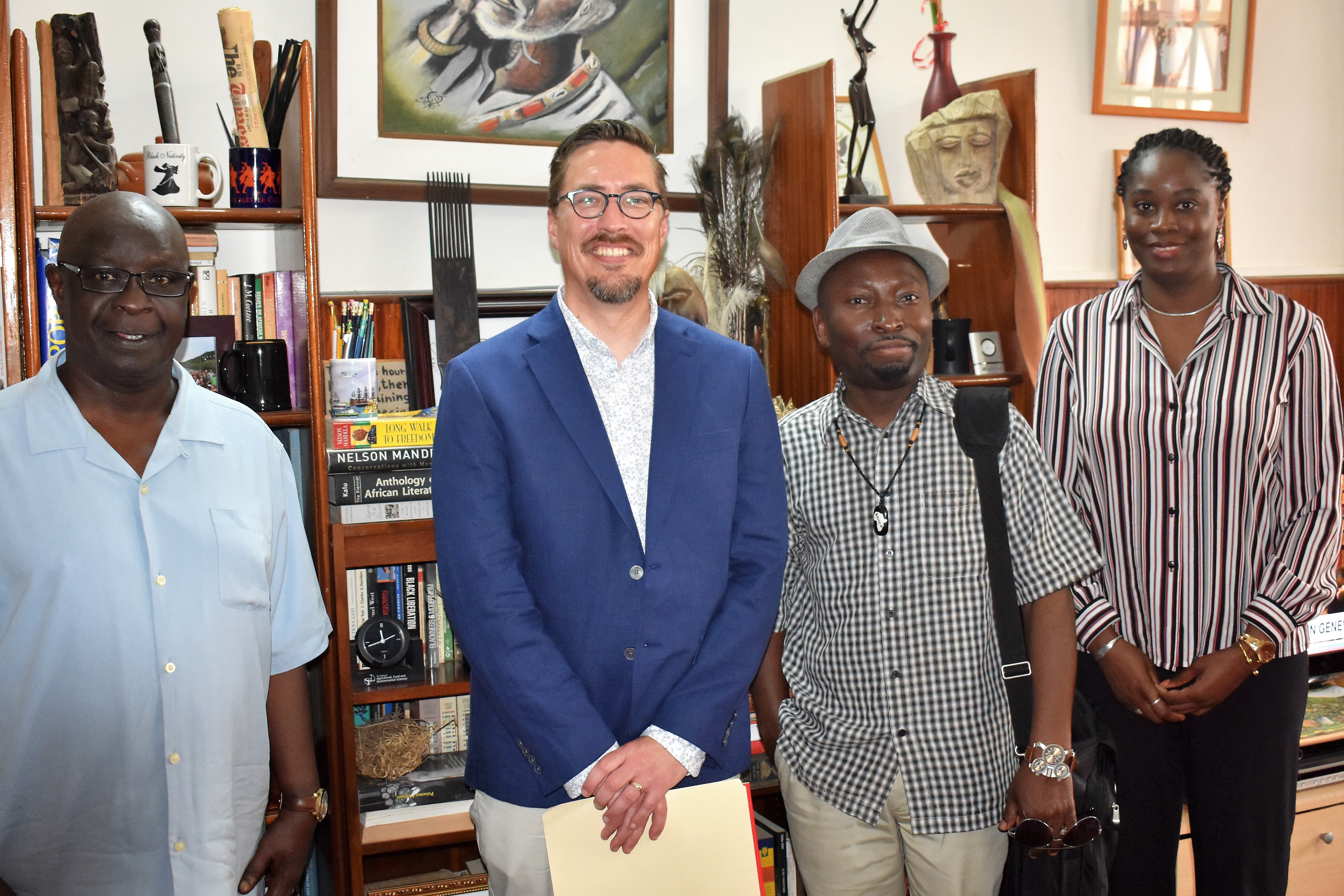Photo of Dr. Adabra next to Dr. Behrend and two people