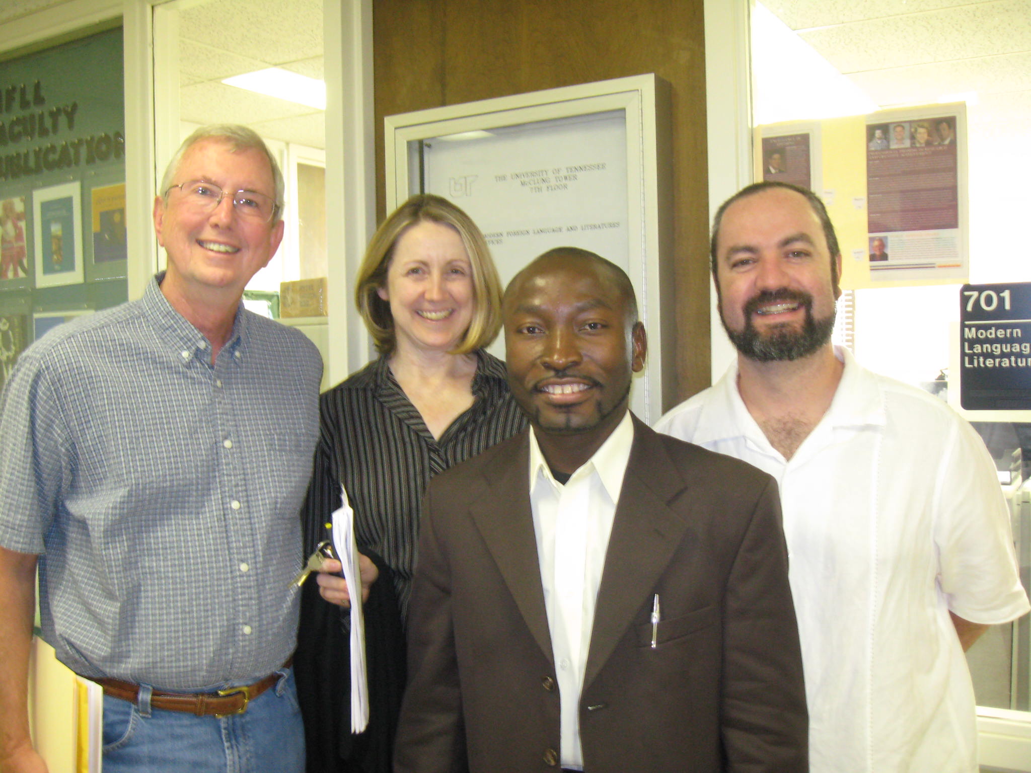Photo of Dr. Adabra standing with three professors from UTK.