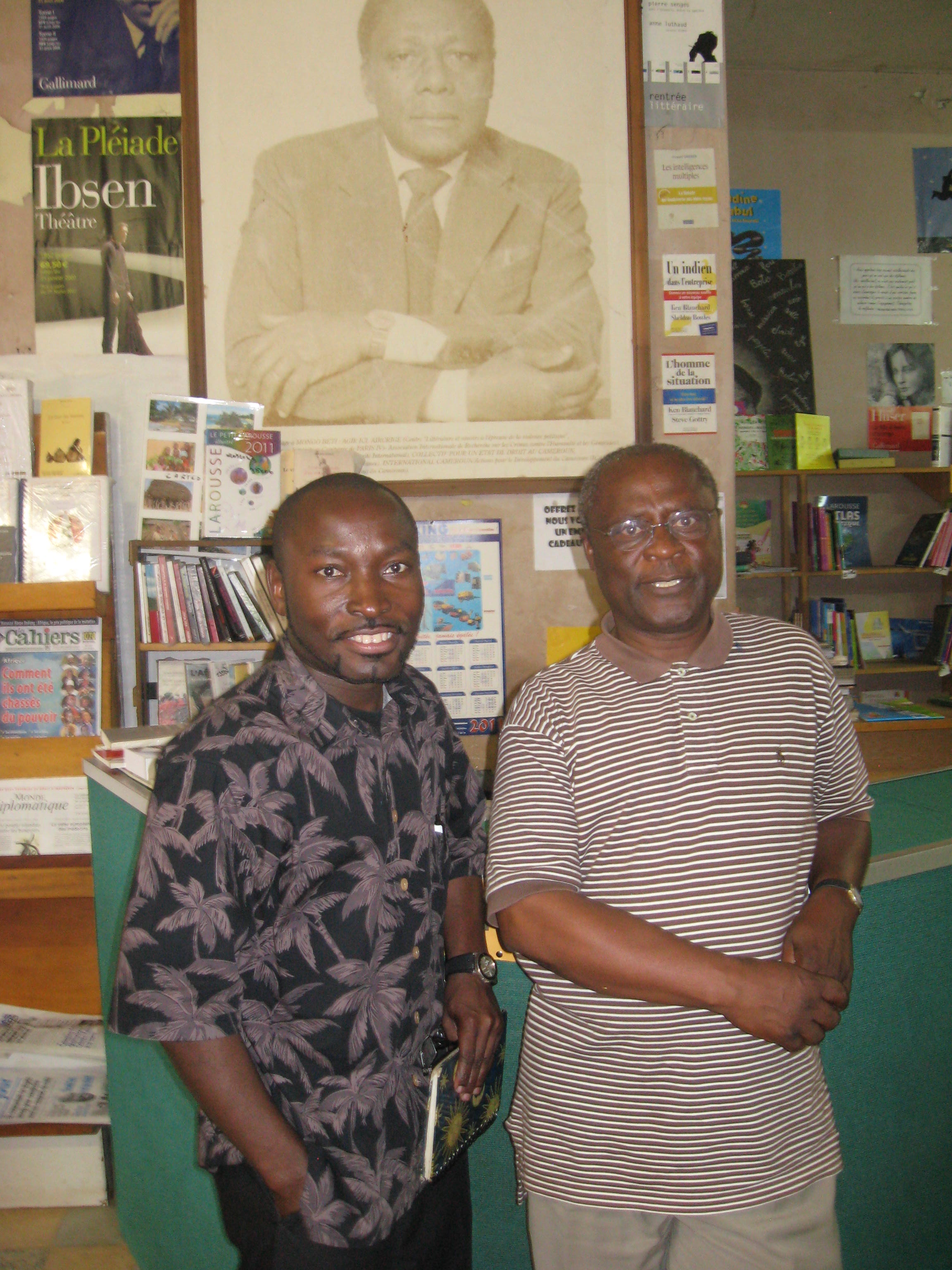 Photo of Dr. Adabra standing next to Ambroise Kom