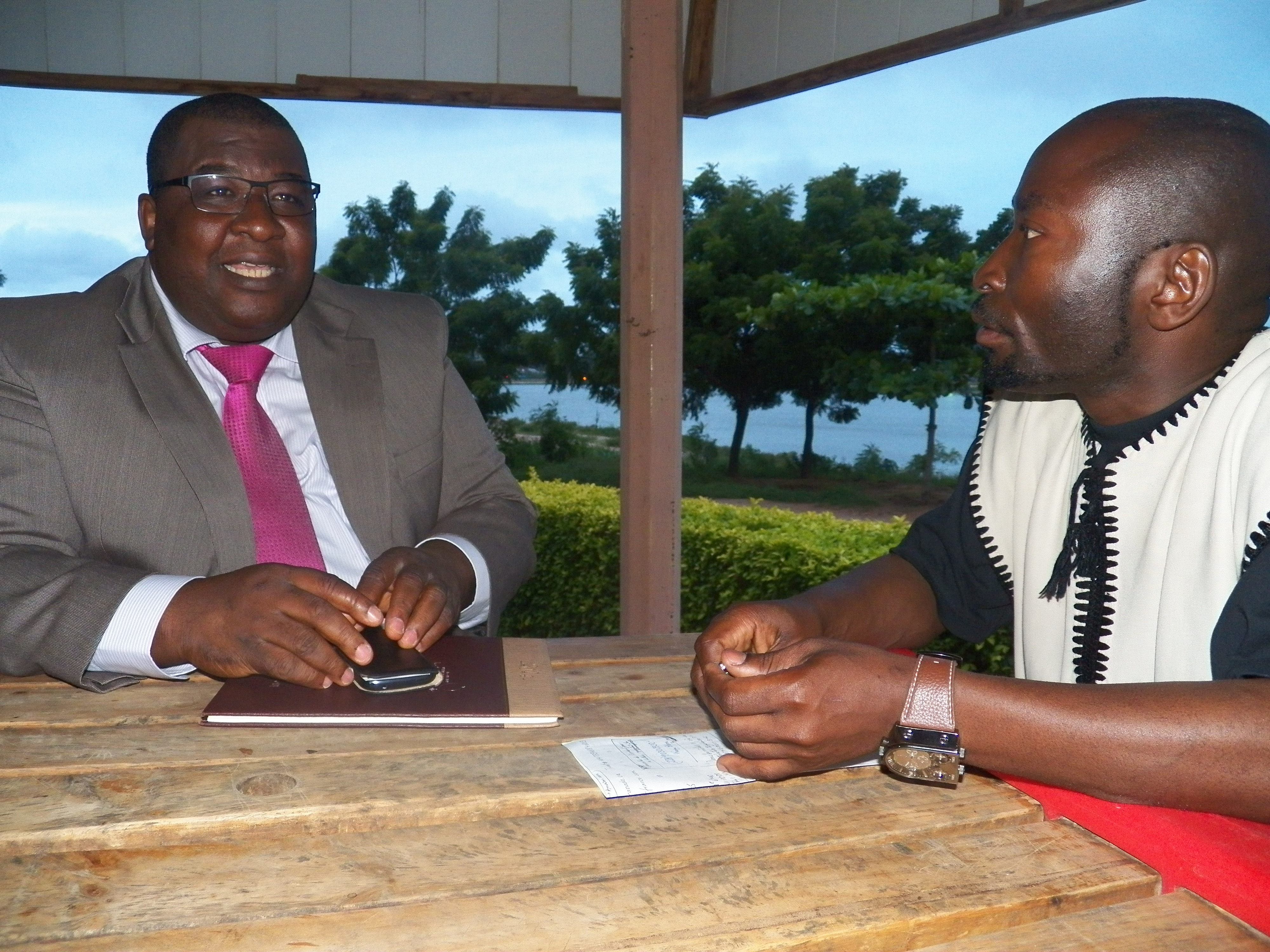 Photo of Dr. Adabra seated next to Kangni Alem