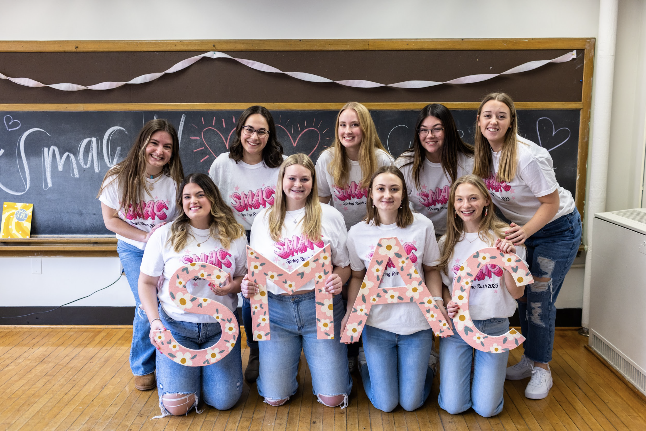 Group of members holding the letters SMAC.