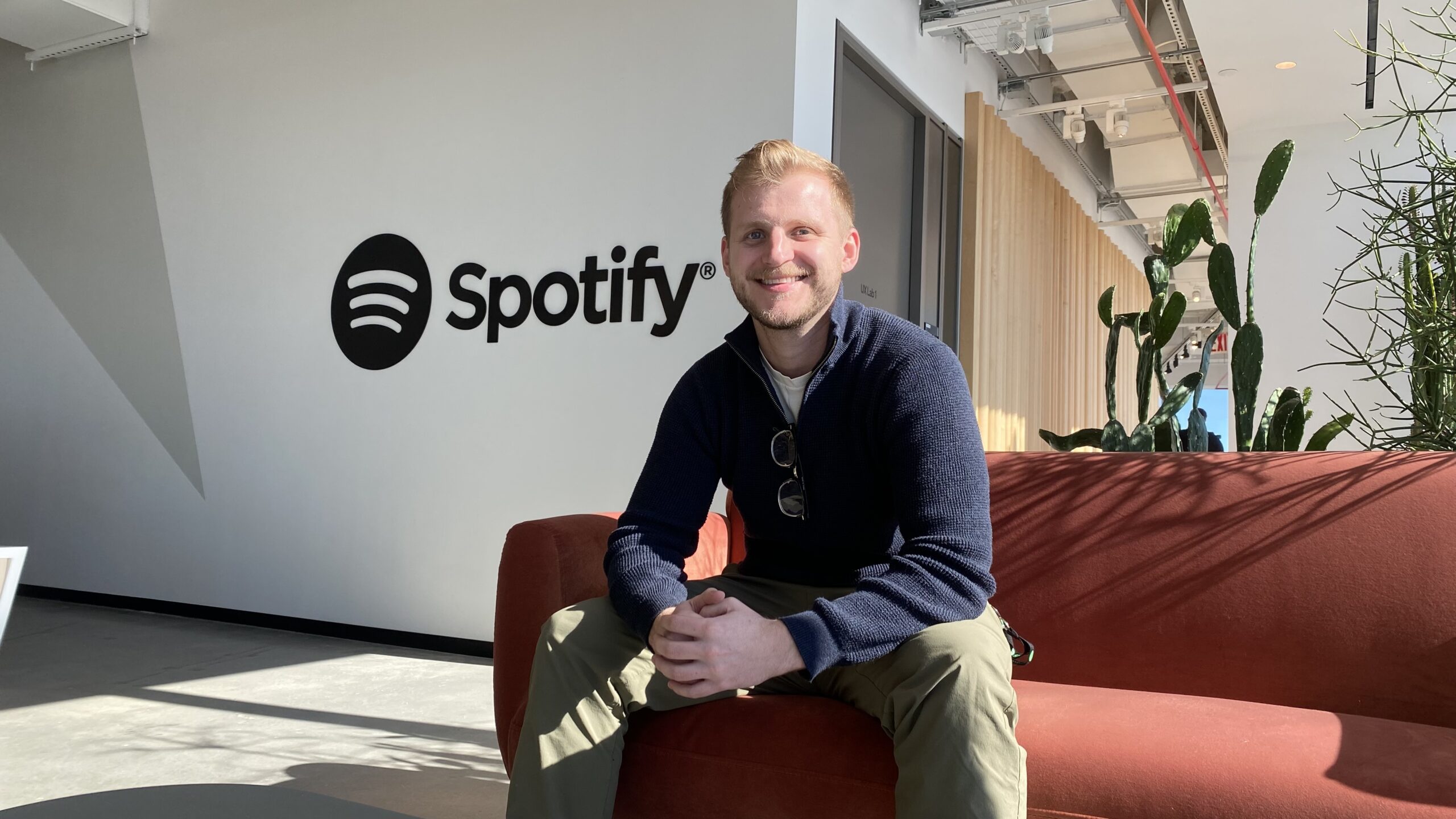 Sam Frenzel '18 sitting on a couch