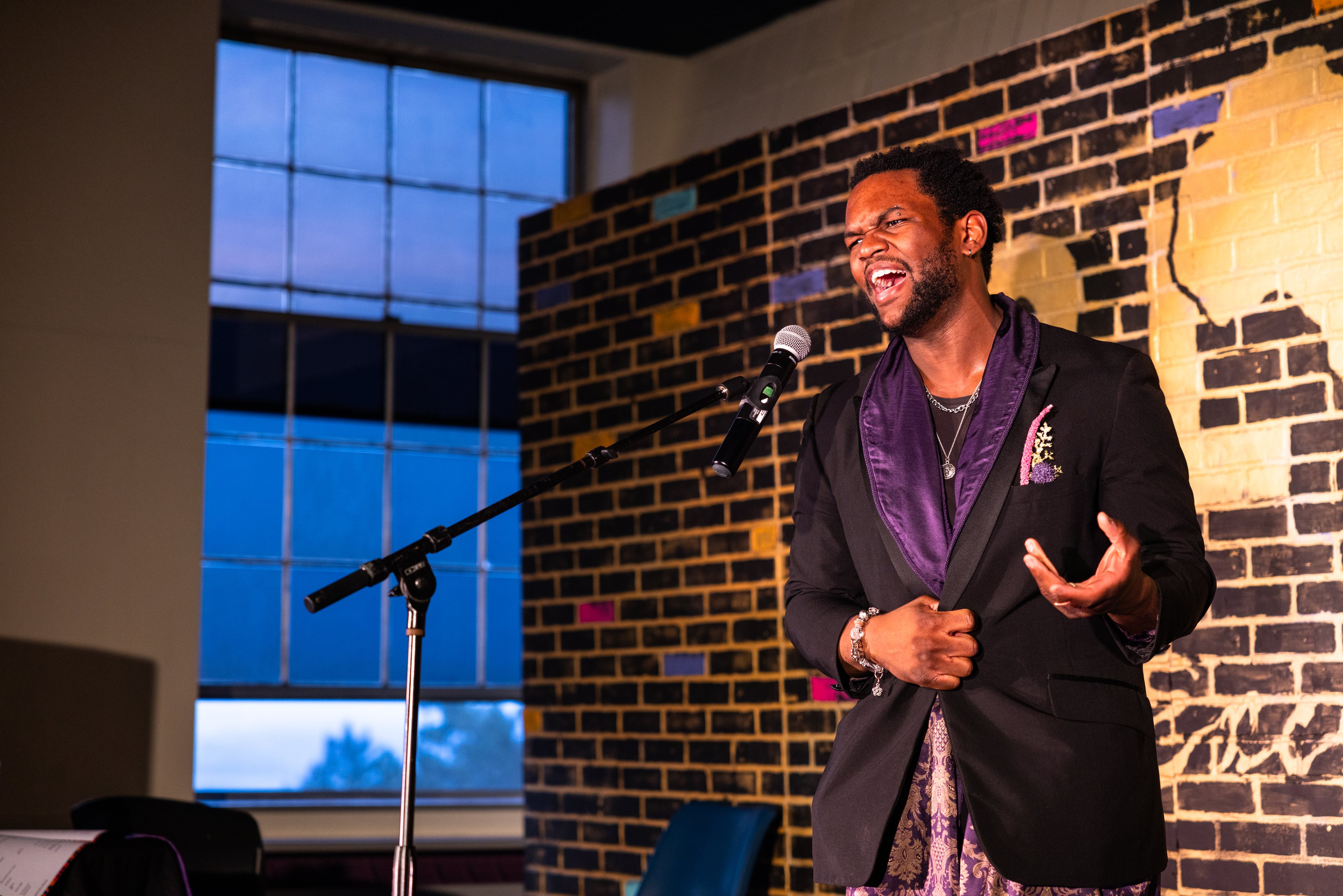 Person singing into a microphone