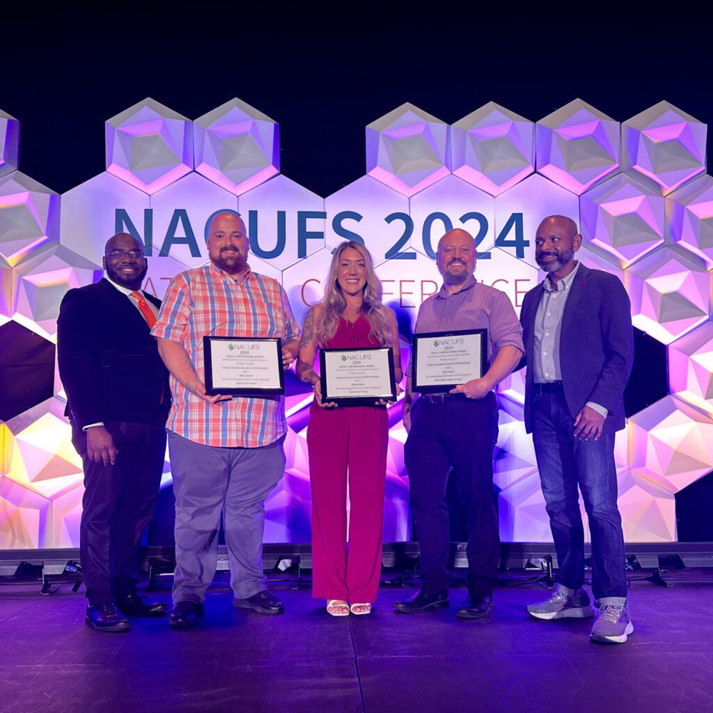 CAS Head Chef Matthew Kershner, Head Chef Oriana Van Buren, and General Manager Keith Rosengren accept 2024 NACUFS Nutrition and Loyal E. Horton Dining Awards.