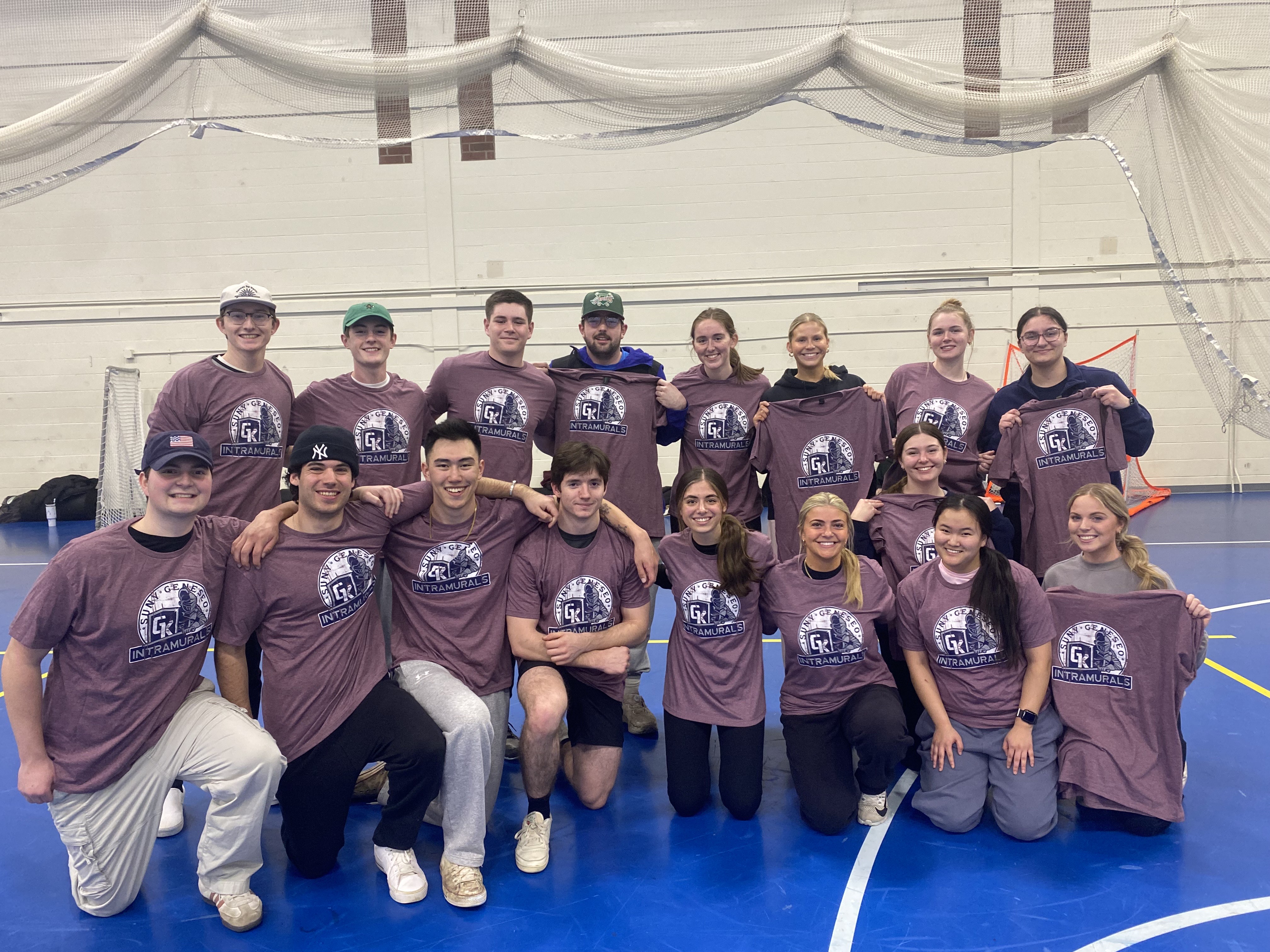 group of students, wearing maroon intramural shirts, in kuhl gym