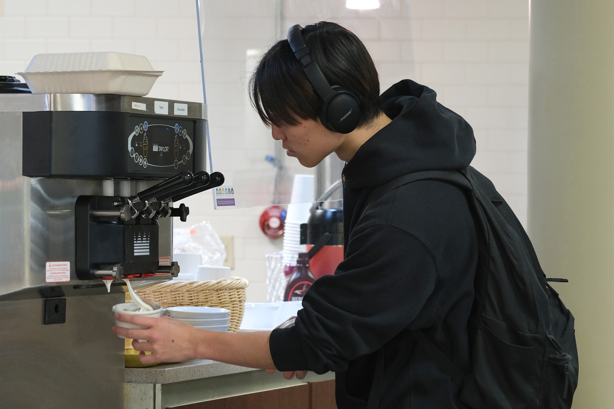 Student getting soft serve ice cream at the Streusel station in Letchworth Dining Complex.